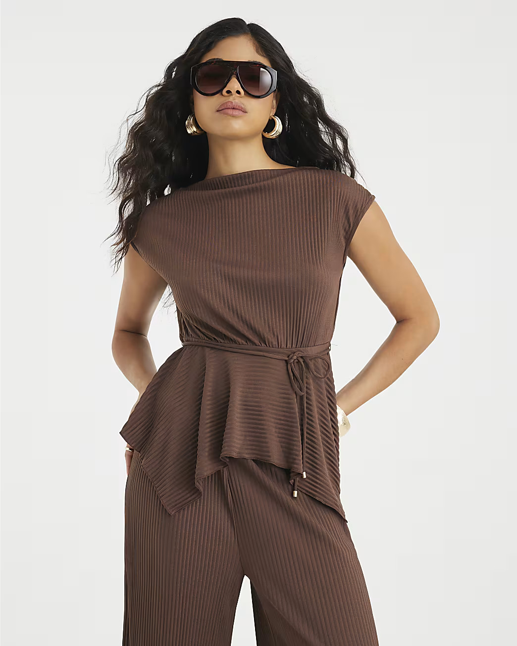 Brown Plisse Sleeveless Peplum Top | River Island UK & IE