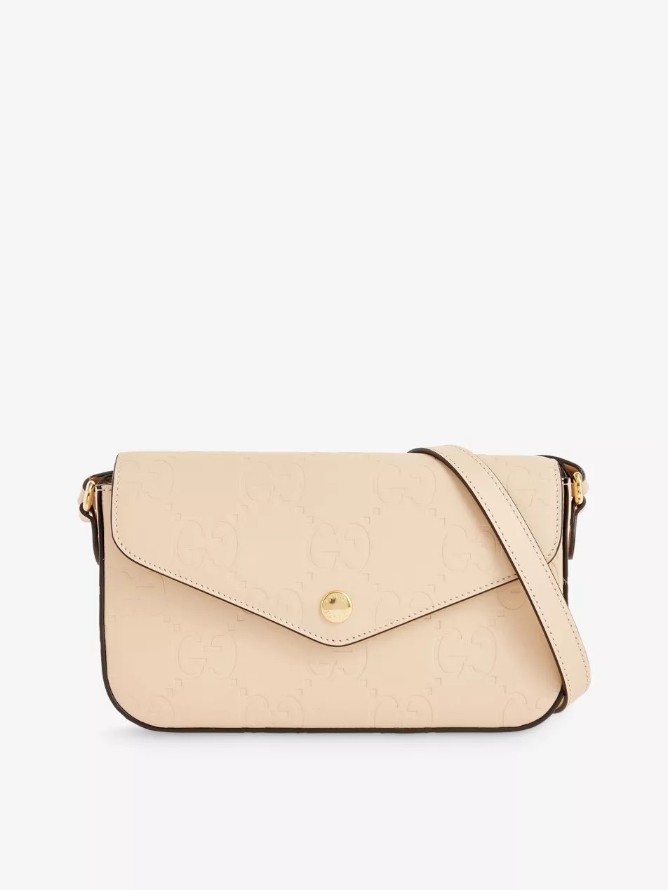 Monogram-embossed leather cross-body bag | Selfridges