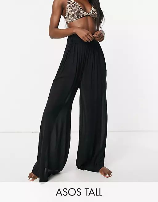 ASOS DESIGN tall crinkle wide leg palazzo beach pants in black | ASOS (Global)