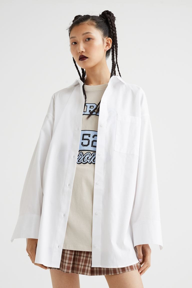 Oversized shirt in crisp cotton poplin. Collar, buttons at front, yoke at back, and a large chest... | H&M (US + CA)