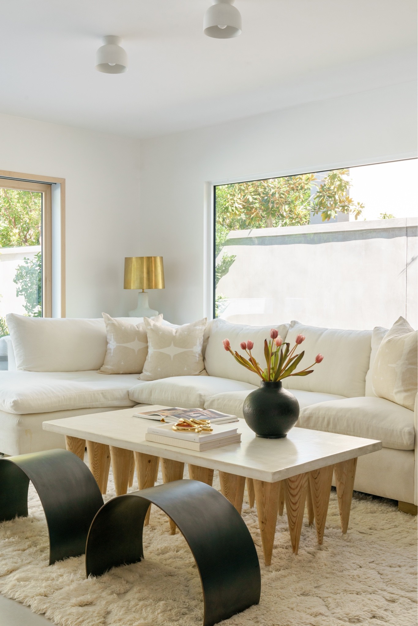 Styling your coffee table doesn’t need to be fussy or complicated. My three go-to items are flowers, an interesting coffee table book left open and some kind of unique object. This brass snake has recently become a favorite of mine.


CB2, CB2 vase, Home decor, Organic modern, Gold snake, Book topper, Coffee table styling, Fresh flowers, Arch stools, Neutral pillows, White sofa, RH Cloud dupe, Cloud dupe, Kelly Wearstler, Kelly Wearstler lamp, Sculptural light, Brass, Brass lamp shade 

#LTKhome #LTKstyletip #LTKsalealert