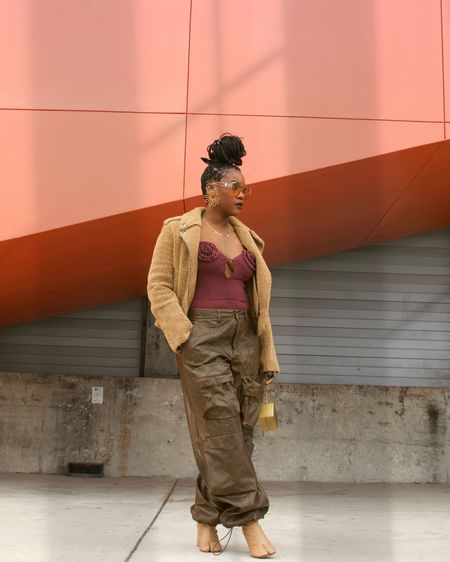 Fall faux leather brown oversized wide leg cargos with belt loops and flower detail burgundy bodysuit  

#LTKfindsunder100