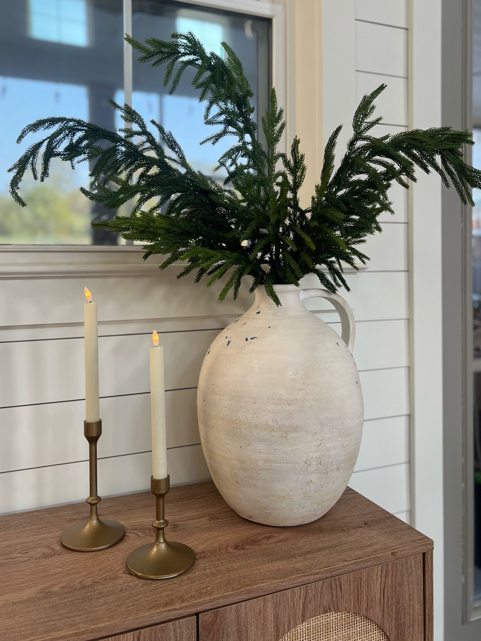 Another holiday decor must have! These Norfolk, real touch. Pine branches are amazing! They are so realistic looking and feeling. I have three in this vase. These have gone viral and sell out early every year so get them while you can. Even if you aren’t decorating until after Thanksgiving, you gotta get the stuff you want when you see it or it will be gone. I have been using these gold candlesticks everywhere! They are from Walmart and I just cannot believe the quality. They are such a great price point. I also pair them with my favorite flameless flickering candles from Amazon and it adds such a beautiful ambience!

#LTKHoliday #LTKHome #LTKStyleTip