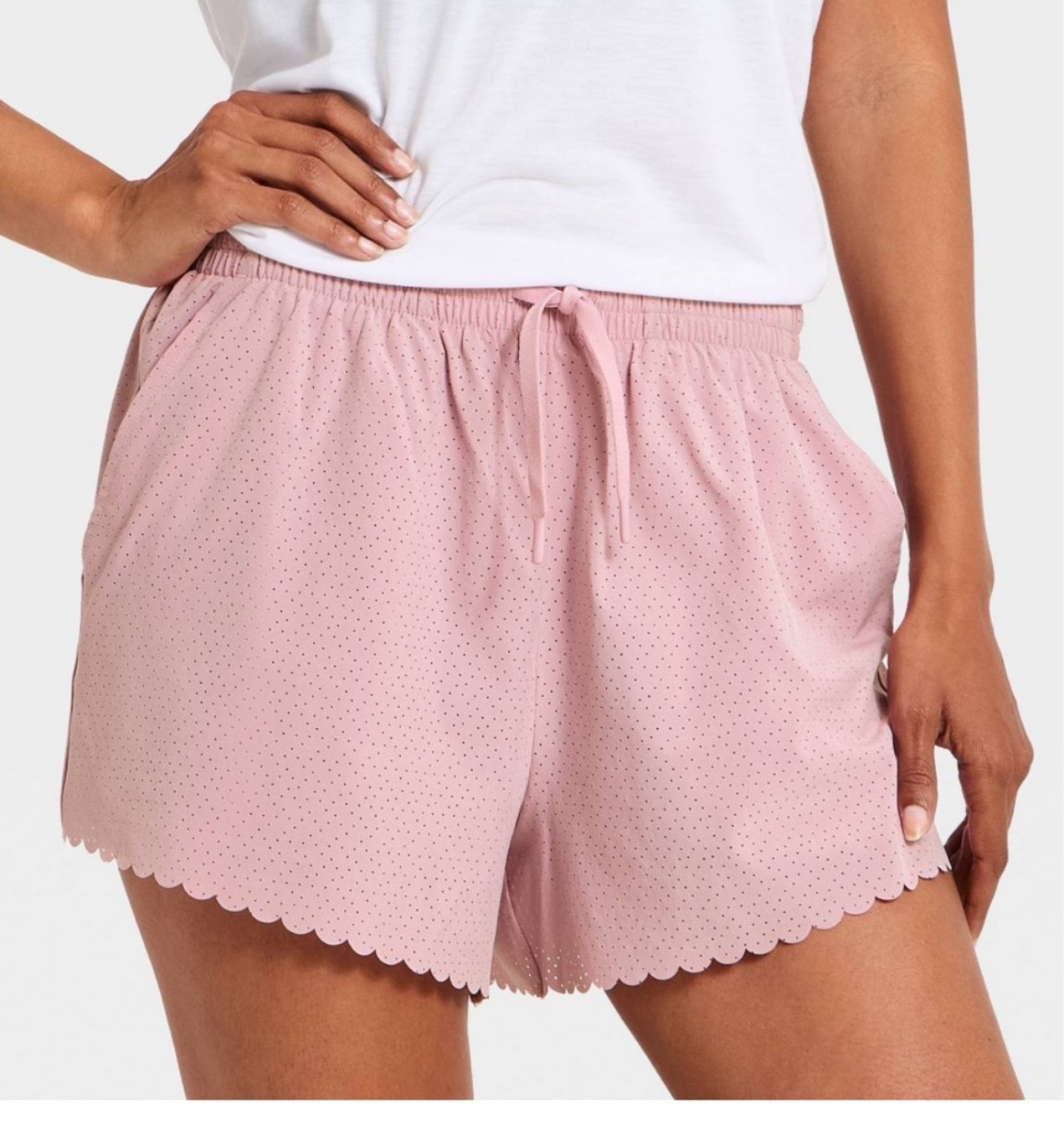 How cute are these scalloped perforated shorts?! Come in this rose color along with blue and black!