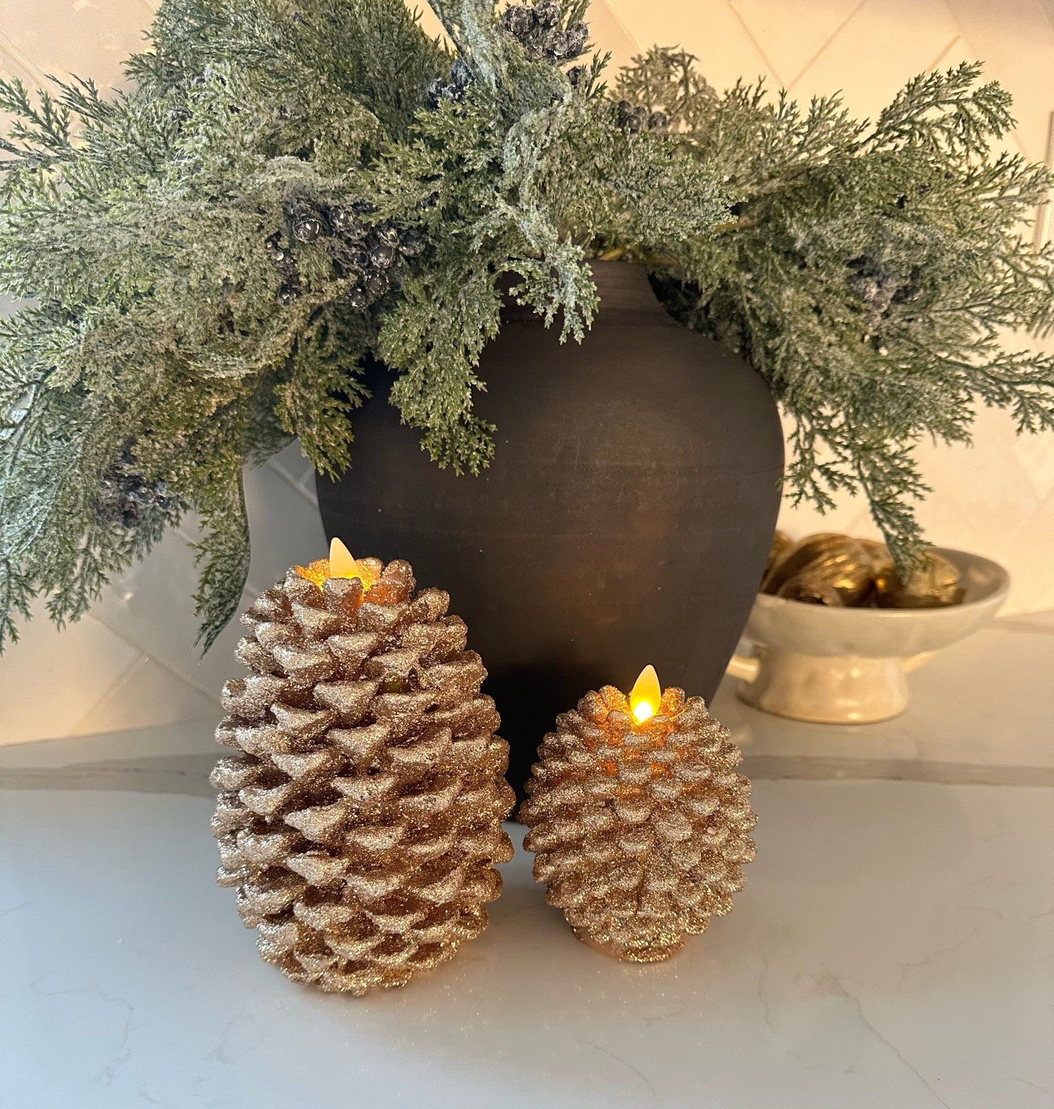 Holiday kitchen vignettes! Pine berry stems, black organic vase, white pedestal bowl, gold figs! Backsplash  tile js cloe in white! Kitchen backsplash tile. Herringbone tile  

#LTKFindsUnder50 #LTKHoliday #LTKHome