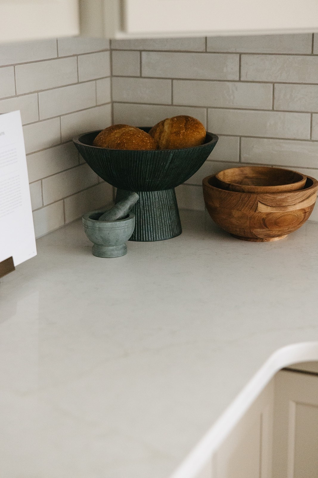 Cozy rustic, transitional, classic kitchen countertop corner decor. 

Cookbooks, cookbook holder, soapstone mortar and pestle, wood mixing bowls, fluted pedestal bowl.

#LTKHome #LTKStyleTip #LTKFindsUnder50