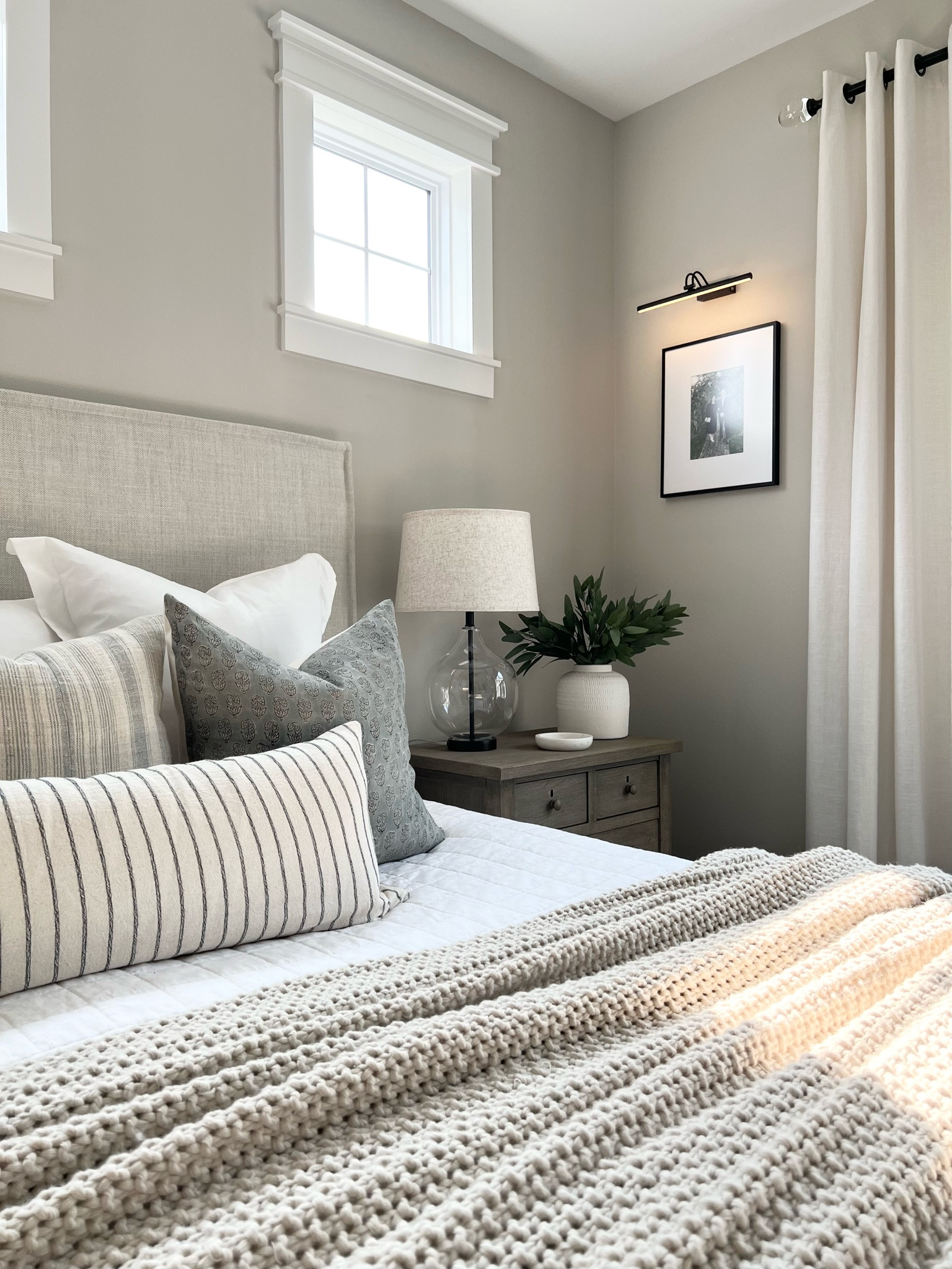 Primary bedroom / bedroom furniture / vase / stems / glass lamp / knit blanket / bedding / nightstand / pottery barn / wayfair bed / gallery light / wall art / picture frames / pillow covers / colin and Finn / transitional decor / neutral bedroom #LTKunder100 #LTKunder50

#LTKhome