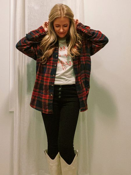 The best(so soft + cozy) oversized flannel paired with a holiday themed graphic tee, black skinny jeans, and boots! 
The A&E flannel is oversized, but i sized up one from my normal size to a Medium for an even more oversized fit • if you want the more oversized look or are in between sizes I’d recommend sizing one up in this one•
Perfect #OOTD 4 the beginning of the weather change to winter 🥶😌🥰
#cozyszn #holidaystyle #winterweatheroutfitinspo 
&&& so many deals on ALL of this right now!
My Jeans from Abercrombie are also super marked down - sizes are going fast, though•don’t miss it! I’ll link a few similar, as well.
&& my holiday graphic is under $30 at Pink Lily‼️
#tistheseason #giftguide #holiyays 

#LTKsalealert #LTKHoliday #LTKSeasonal