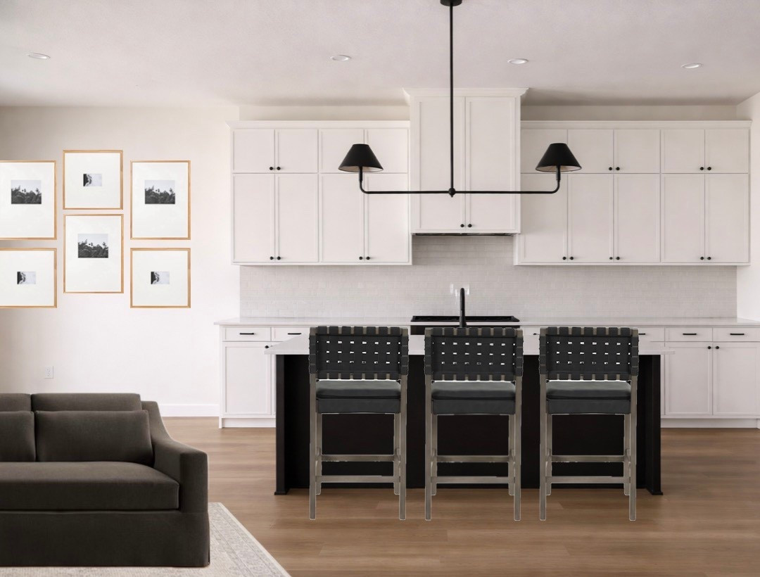 Timeless neutral kitchen with warm modern contrast 🖤

This kitchen is all about clean lines, warmth, and contrast. The black island grounds the space while the white cabinetry keeps everything feeling light and airy. Paired with warm wood floors and soft textures, it creates that perfect balance of modern and inviting.

We kept the styling minimal and intentional to let the finishes speak for themselves. The black linear chandelier adds just enough edge without overpowering the space.

If you love a neutral kitchen that doesn’t feel cold, this is exactly how to layer it.

Linked everything I could find including
counter stools
black linear chandelier
kitchen hardware
decor and styling accents
runner and neutral finishes

Save this for neutral kitchen ideas, black and white kitchen inspiration, and warm modern home design.