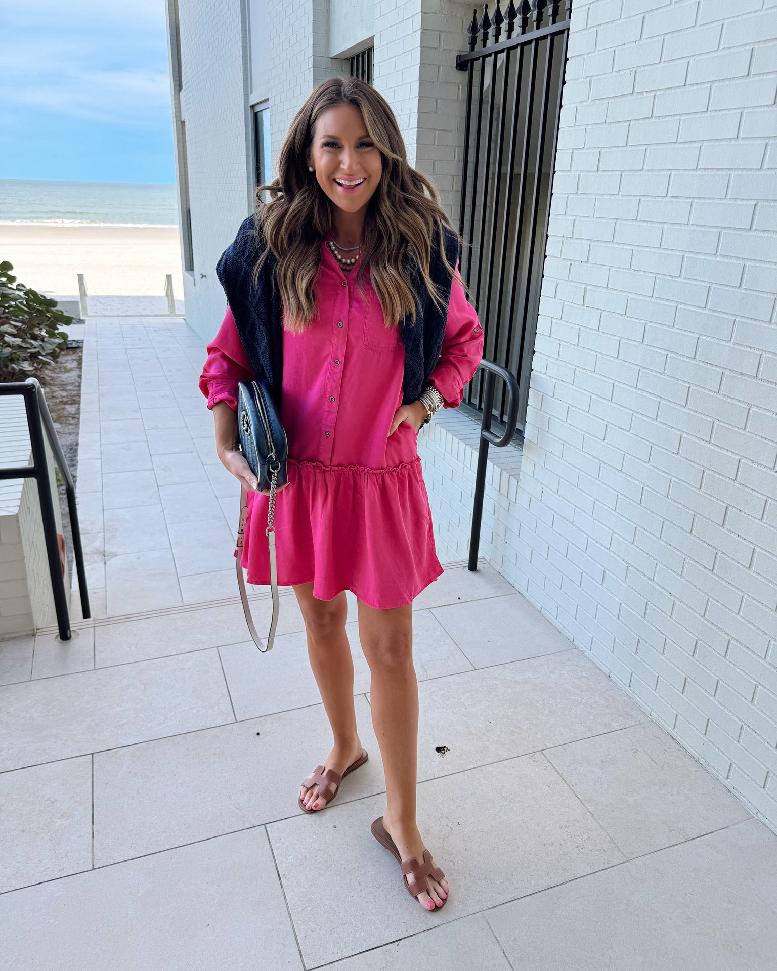 In a medium long sleeve button down dress with ruffle skirt, medium chunky knit sweater, sandals and accessories for spring/beach/cruise outift - all fits TTS.

#LTKfindsunder50 #LTKSeasonal #LTKstyletip