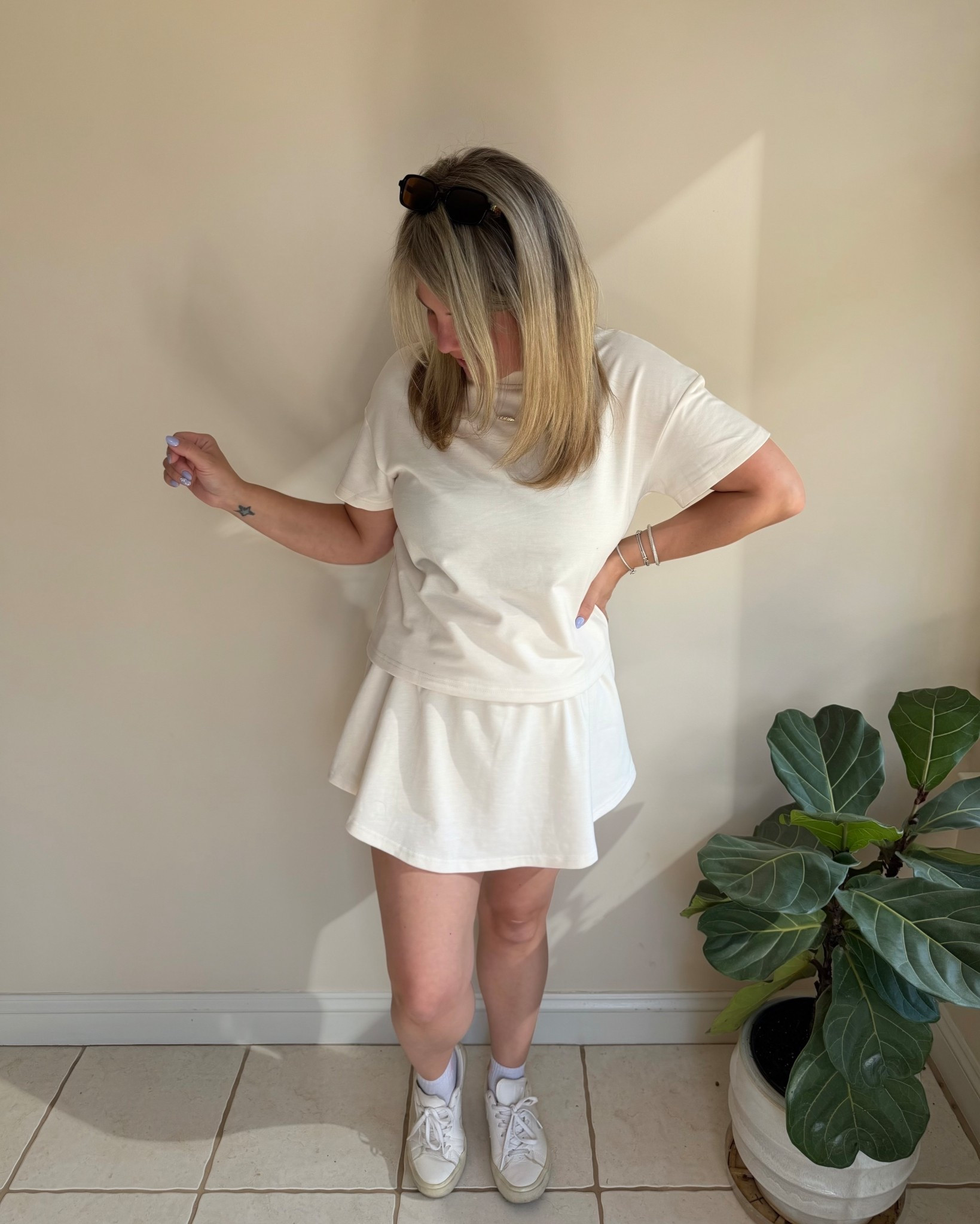 This set is one of those throw on and go outfits that requires no thinking. The skirt has built in shorts underneath which is honestly a non negotiable for me right now. 

#LTKOver40 #LTKmomlife #LTKootd