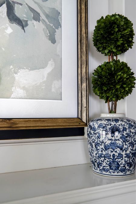 I framed our picture frame TV above our mantle and added these ginger jars and topiaries to each side of the TV. I really love the look and the ability to change out the art picture on the TV regularly.

#LTKhome