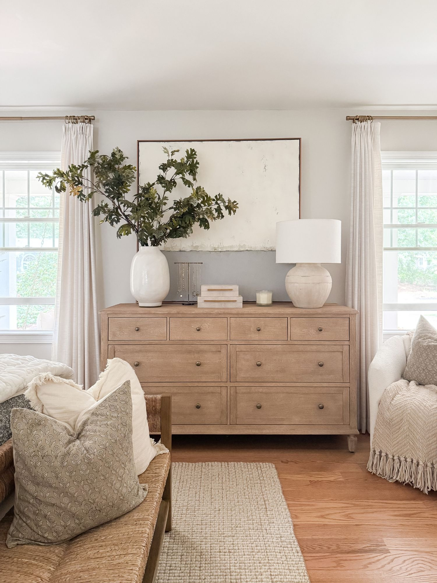 Light wood furniture styled with ceramics and greenery brings warmth and balance to the bedroom. coastal bedroom furniture, wood dresser styling, neutral home decor, coastal interiors, bedroom styling ideas, timeless bedroom, natural textures, home inspiration, sherricalnanhome

#LTKHome