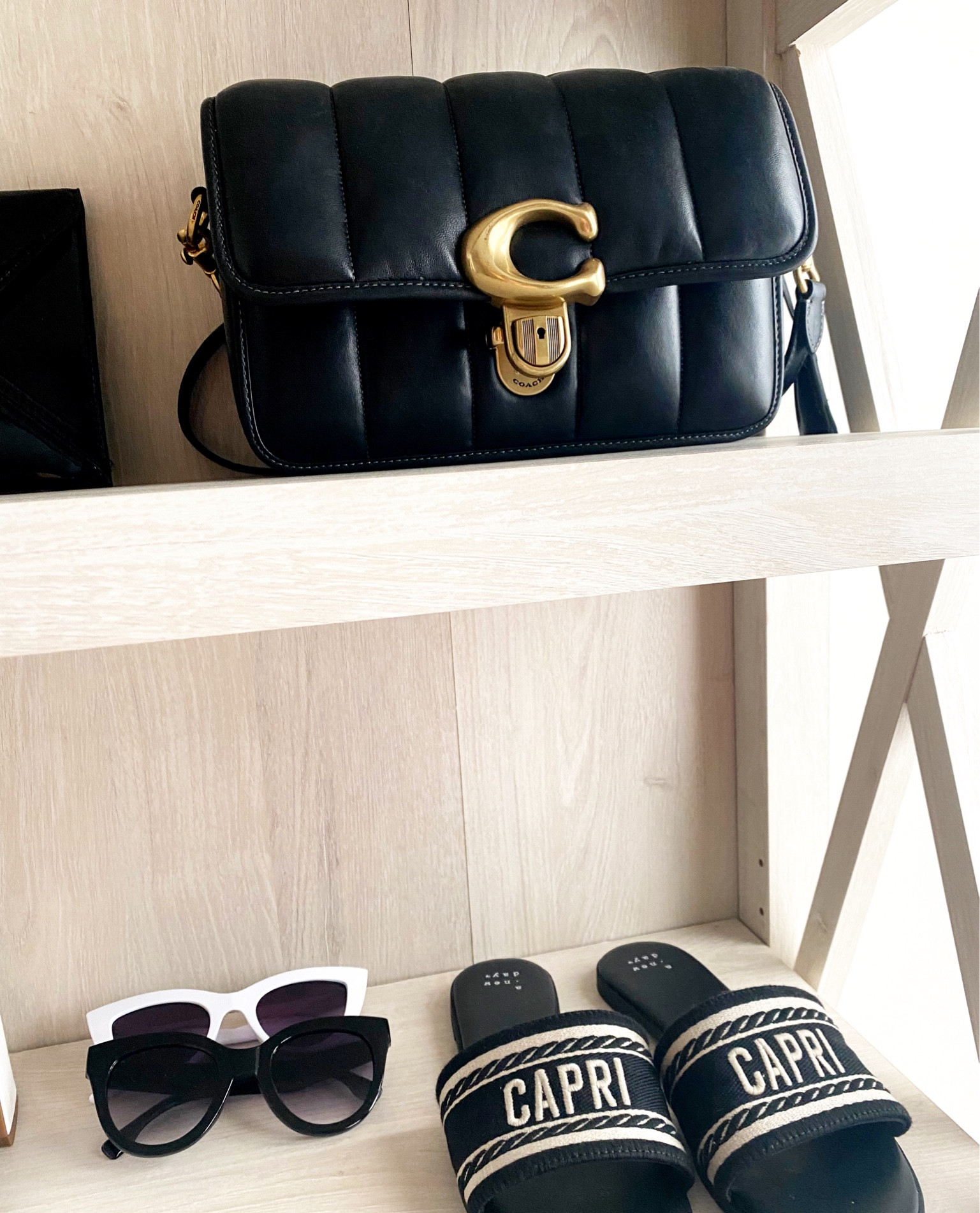 Looking to build your capsule wardrobe? I love the #coachbag quilted bags for their timeless versatility. Target also has amazing inspired sandals such as the Capri Sandals! #TargetFinds #Target #CoachFinds #CoachBag #Minimalist #BlackAndWhite 

#LTKParties #LTKItBag