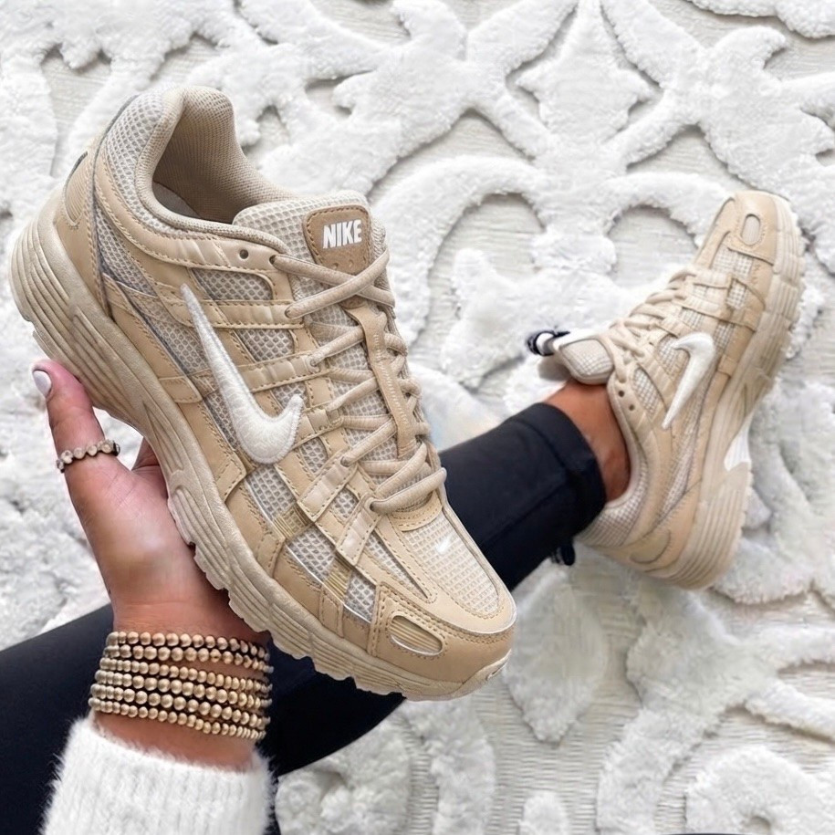 NIKE P-6000 WOMEN’S SHOES

The Nike P-6000 is the perfect mix of sporty and cute with its dreamy neutral beige color that goes with literally everything. 🤍 Whether you’re styling them with leggings, denim, or your favorite athleisure set, these sneakers instantly pull your outfit together while keeping you comfortable all day long. They’re lightweight, breathable, and the kind of sneaker you’ll find yourself reaching for on repeat.

Fit: Runs true to size. If you’re between sizes or have wider feet, consider going up a half size for the most comfortable fit. ✨
