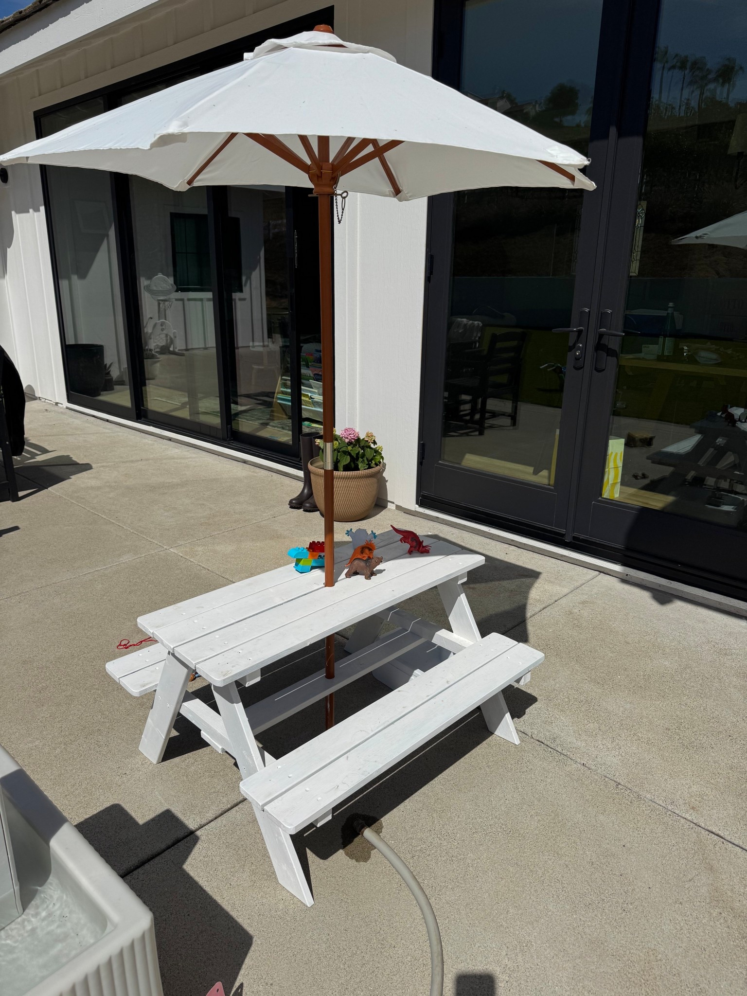 The cutest kids picnic table! It comes wood but we painted it white 