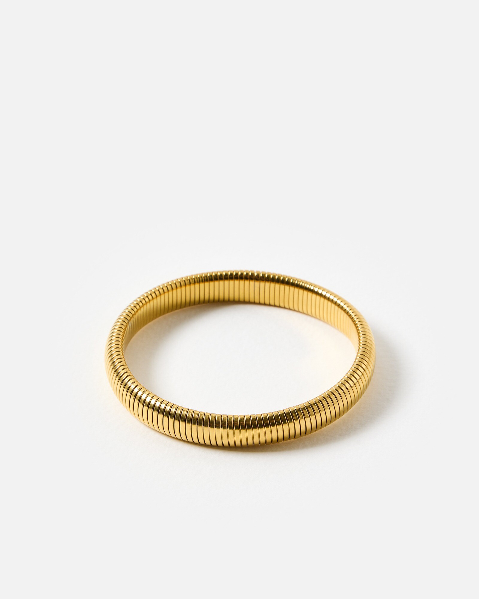 Edith Gold Tone Stainless Steel Waterproof Stretch Bangle Bracelet | Oliver Bonas (Global)