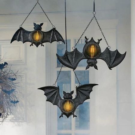 Bat Lanterns Halloween Decor
Hang several to light a spooky stairwell or along a wooded path. Each Bat Lantern glows with a battery-powered Edison bulb at the center and includes a metal chain for convenient placement nearly anywhere, indoors or out. Set the optional timer to turn on and off at the same time each night, all by itself.

#halloween2023 #halloweenvibes #halloweendecor #halloweenseason #vampirebat #hanginglantern #outdoordecor #halloweeniscoming

#LTKSeasonal #LTKHoliday #LTKSale