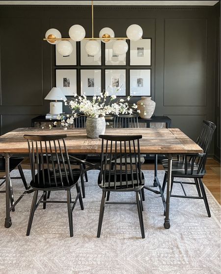 Moody modern traditional dining room with spring florals. A black and white gallery wall is a foolproof way to fill a space. 

#LTKSeasonal #LTKhome #LTKstyletip