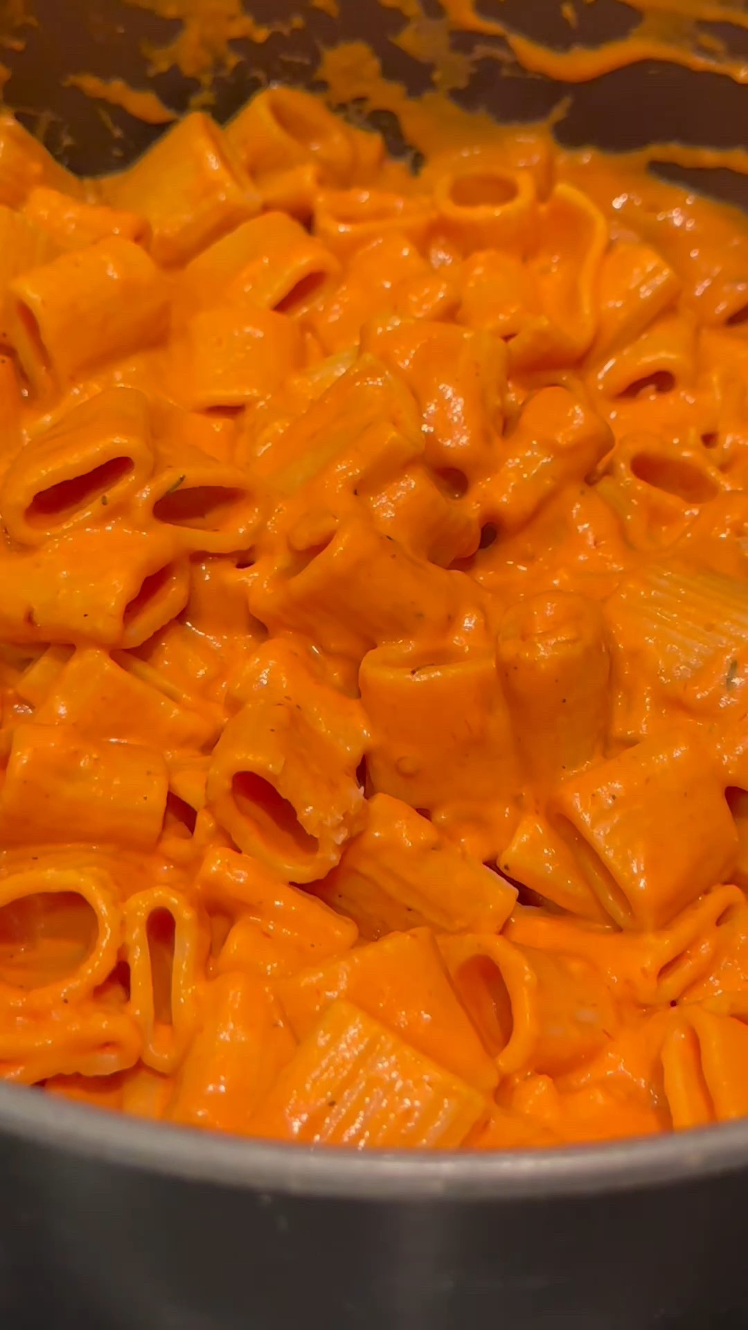 This pasta is on just about every menu and it's so easy to make at home. I bet you already have most of the ingredients on hand. Here's my easy Rigatoni alla Vodka. Save this for your next comfort food craving. 

Here's what you'll need: 
2 tbs olive oil
1/2 small onion, diced
2 cloves of garlic, grated
8oz tomato paste
1 1/2 cup heavy cream
1/3 cup vodka
2 tsp italian seasoning
1 tsp crushed red pepper
Salt and Pepper to taste
1 box of rigatoni
3/4 cup freshly grated parmesan
1/2 cup pasta water
3 tbs butter

Here's how you make it: 
Saute onions in olive oil until softened.
Add garlic and cook for 1 minute.
Add tomato paste and stir until combined. 
Add seasonings and vodka. Let cook for two minutes. 
Add heavy cream slowly, continuously stirring until well combined.
Let cook 8-10 minutes on low. 
Boil pasta. Once almost done, add about 1/2 cup of the pasta water to the sauce to thin.
Add pasta and combine. Finish with butter and parmesan. 

#LTKFamily #LTKHome