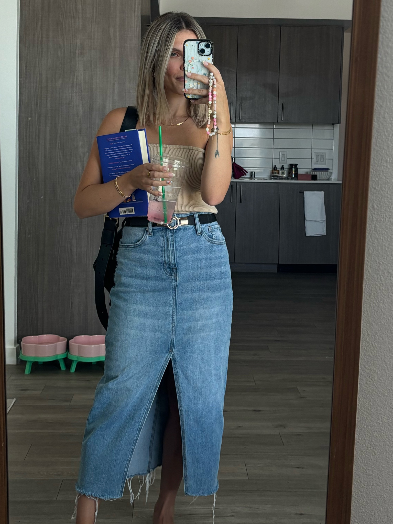 Sweater material tube top paired with an Amazon belt and a maxi denim skirt 

#LTKeurope #LTKstyletip