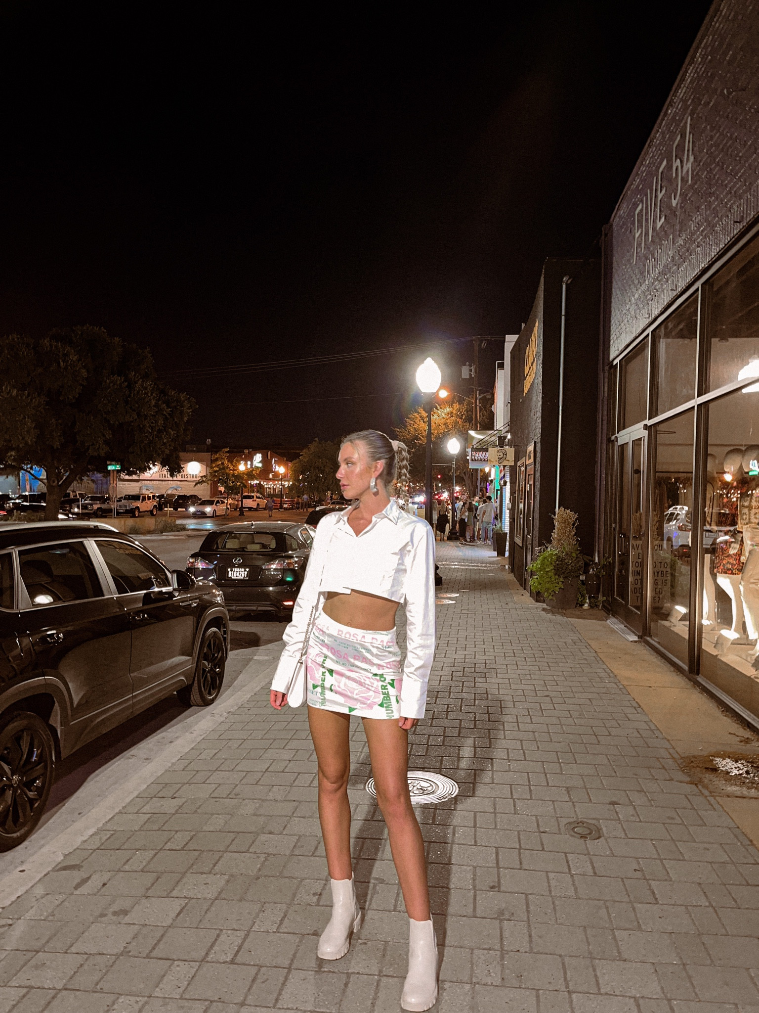 that girl outfit, girls night out 'fit, white outfit, spring outfit, spring style, summer outfits, summer style, mini skirt, graphic skirt, floral, booties, cropped top, crop top, crop blouse, button down, chunky jewelry, fashion accessories

#LTKSeasonal #LTKFestival #LTKstyletip