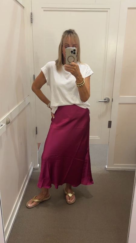 This pretty magenta satin skirt is cut on the bias. Wearing a small. 

#LTKSaleAlert #LTKOver40 #LTKFindsUnder50