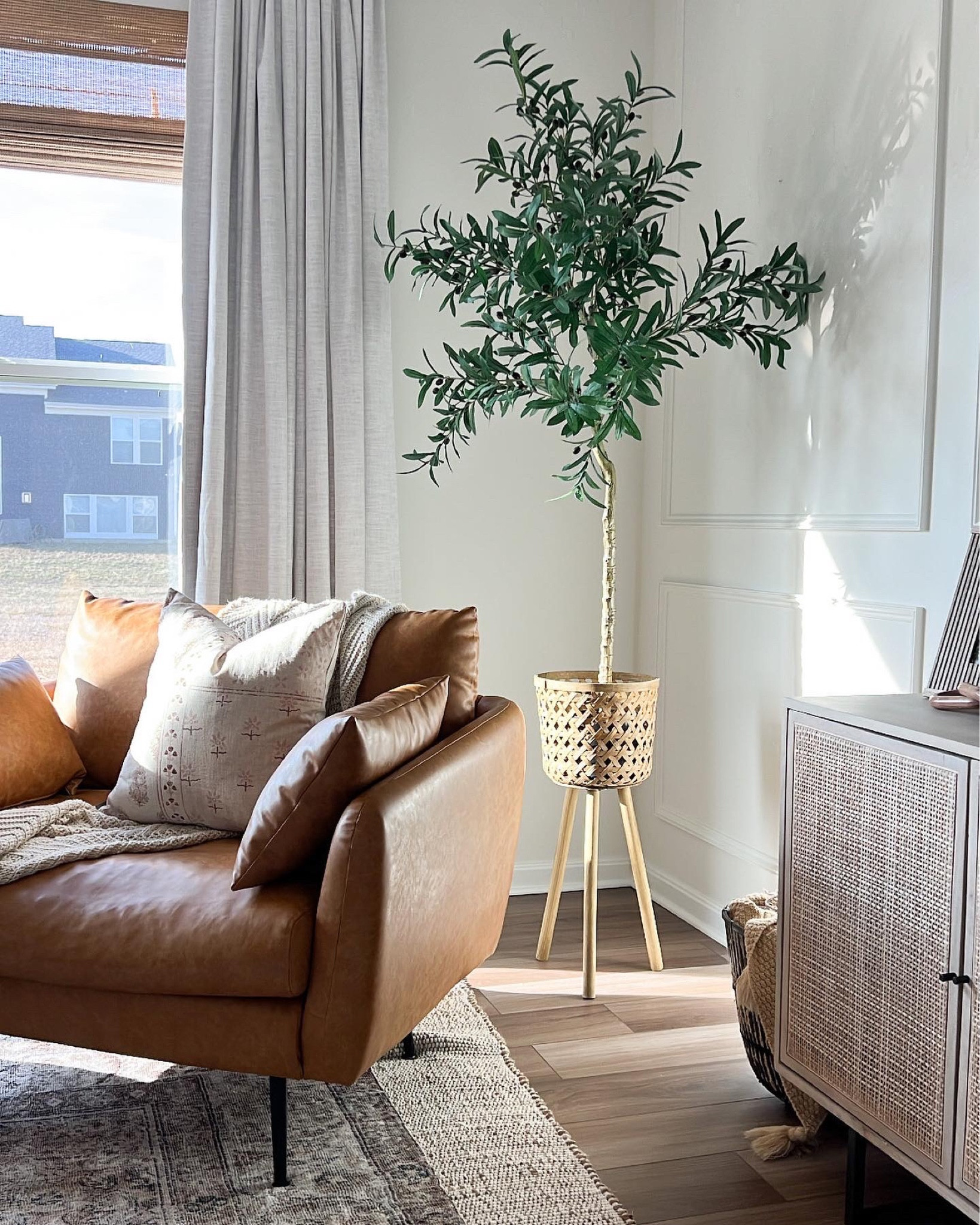 My bamboo Roman shades are back in stock! Great price and makes a huge impact in our living area! 

Bamboo Roman shades, leather accent chair, olive tree, sideboard, loloi rug, jute rug, pinch pleat curtains 

#LTKFind #LTKhome