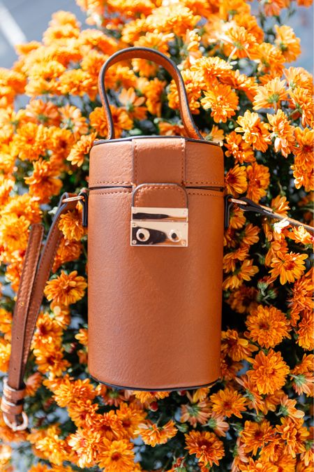 A classic cognac color with a fun cylinder shape, this cross body bag, also featuring a top handle,  adds unique charm to any ensemble! ✨

#LTKfindsunder50 #LTKitbag #LTKGiftGuide