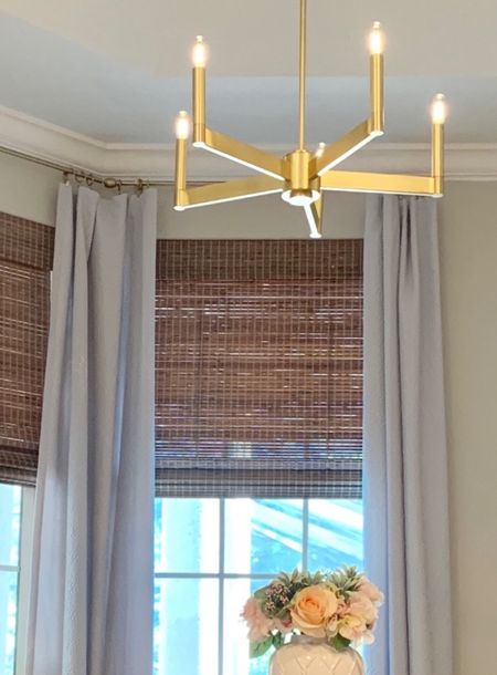 Home decor, woven blinds, modern gold chandelier 

#LTKfamily #LTKhome #LTKstyletip