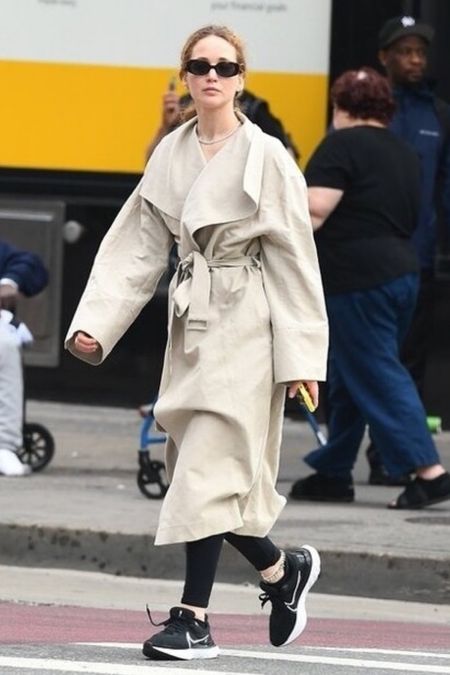 Shop Jennifer Lawrence signature linen belted fold over coat, Nike sneakers, oval oversize sunglasses, black leggings #JenniferLawrence #CelebrityStyle

#LTKStyleTip