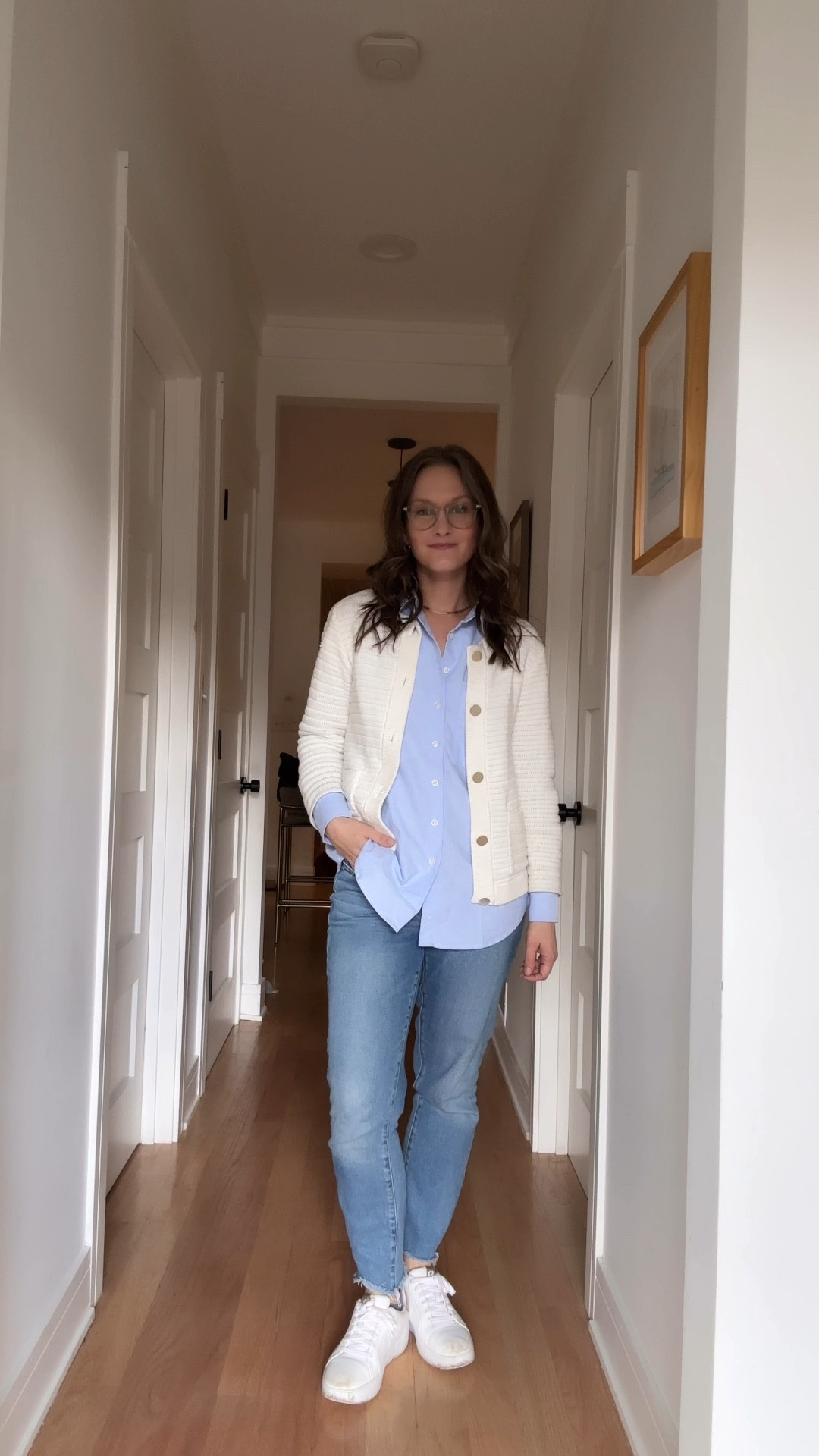 On a crisp Friday morning in early January, she was the picture of casual sophistication as she dropped her son off at daycare and snagged her favorite seat at the co-working space. Skinny jeans with a raw hem gave just the right edge to her polished blue oxford shirt—a thoughtful Christmas pick from her husband—layered under a cozy white cardigan with gold buttons that sparkled like tiny little victories. Her gold hoops and matching necklace tied it all together, because even errands deserved a little sparkle. And errands were indeed the afternoon’s agenda: ticking off to-dos while breezing through the city, feeling like she was nailing this whole “new year, fresh start” thing, one stylish step at a time.

#LTKFamily #LTKStyleTip #LTKWatchNow