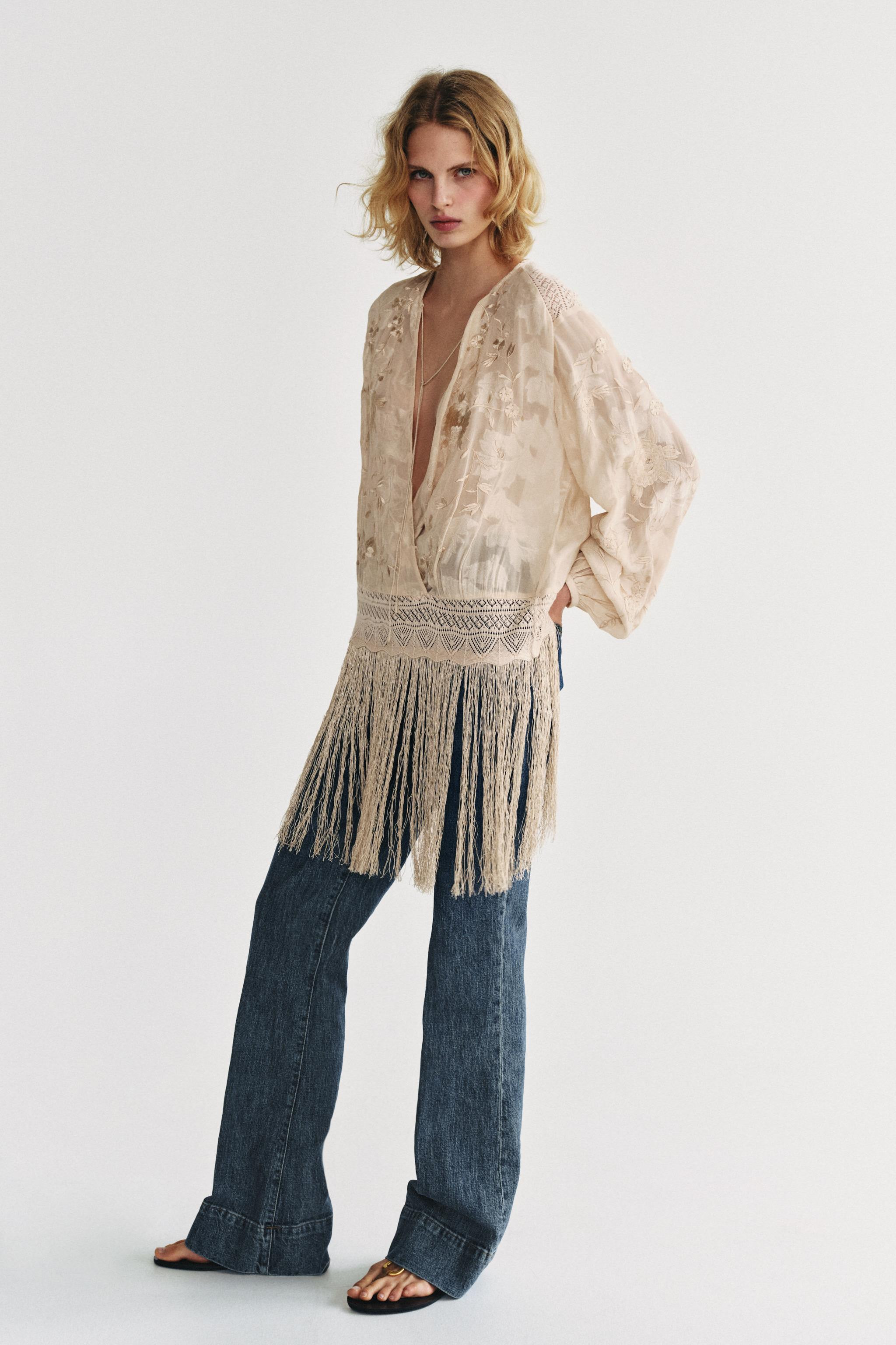ZARA WOMAN COLLECTION. Blouse with main fabric made from viscose yarn. V-neck and long sleeves. F... | Zara UK
