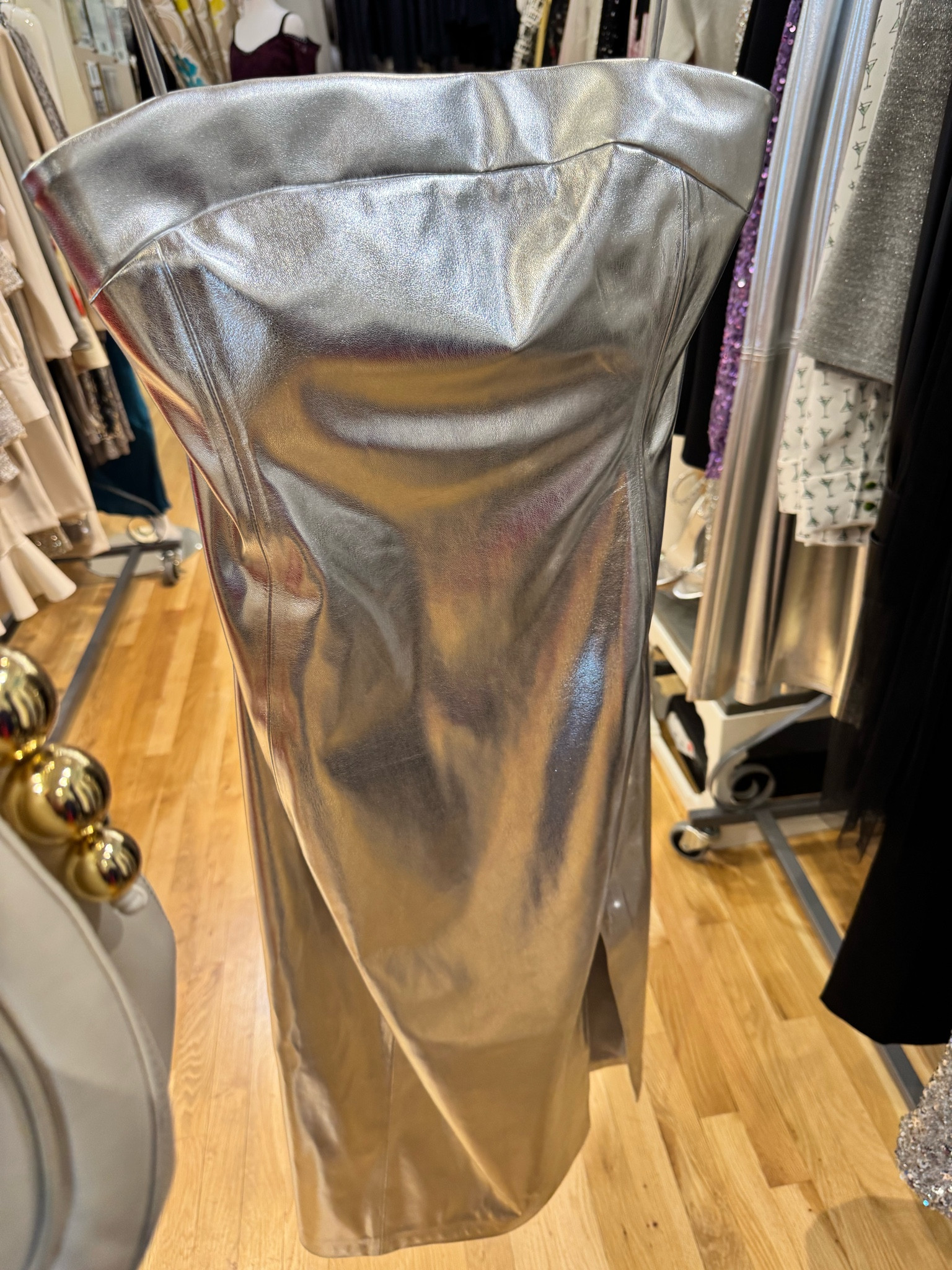This sleek silver dress with a front side slit is elegant and modern to wear out at night with a cropped jacket or blazer or wear it to your next holiday party. Silver is styling. 

#LTKHoliday #LTKSeasonal
