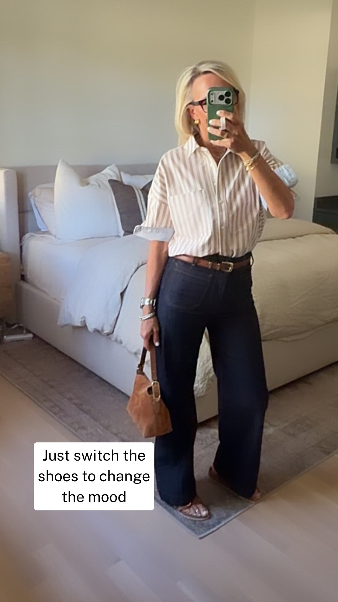 This is one of those outfits that makes getting dressed feel easy. I love the contrast of the relaxed striped Oxford shirt with high-rise wide-leg jeans—the proportions are comfortable but still feel polished.

I’m wearing a small in the shirt and a 27 in the jeans, both true to size. Add sandals for an easy daytime look, or switch to loafers or ankle boots when you want to dress it up a bit.

#LTKOver40 #LTKgrwm #LTKootd