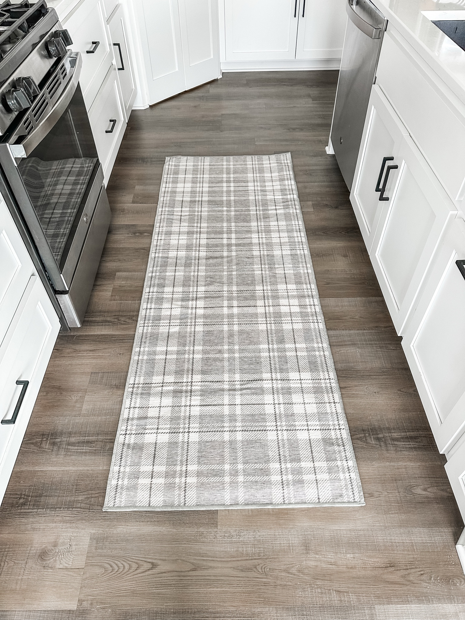 New year, new rug! I finally tried Ruggable to refresh my kitchen runner. I have bought three other rugs in the past few years for this area and every single one moves around when the dogs run over it and curls at the ends (which has make all of us trip more than once). 

I was skeptical about this one working the way they claim to, but after having it in my kitchen the past two weeks I’m 1000% sold. The base mat under the decorative rug keeps the entire thing in place on my hardwoods and there is NO curling at the ends! I’m team Ruggable for life after this first purchase! 

#LTKFamily #LTKHome