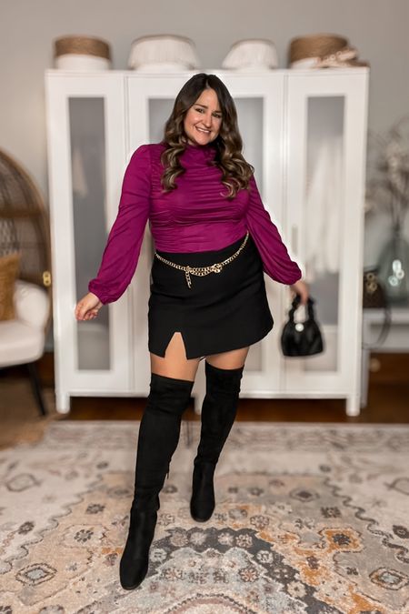 Super cute date night or holiday party or girls night out look! 

Wearing an XL in the ruched mock neck blouse, XL in the mini skort, over the knee boots are true to size! 

The gold chain belt really pulls the look together!

Midsize
Curvy
Black skirt
Mini skirt
Wide calf boots
Amazon fashion
Purple top
Night out outfit


#LTKshoecrush #LTKmidsize #LTKparties