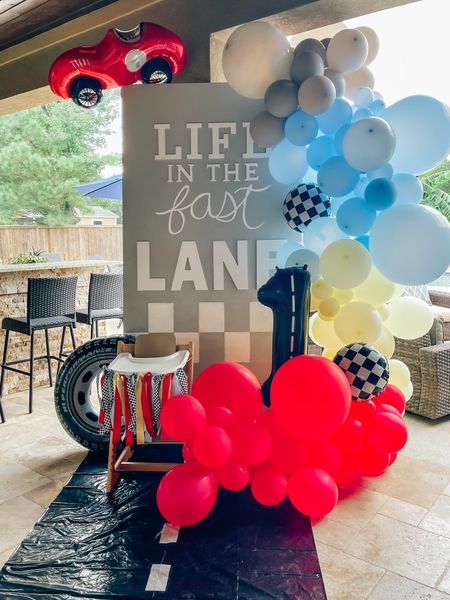 Life in the fast lane baby boy first birthday party decor cars vintage race car party // balloon garland // backdrop// letters and ribbon from hobby lobby! 1st birthday party theme decor

#LTKfamily #LTKbaby #LTKkids