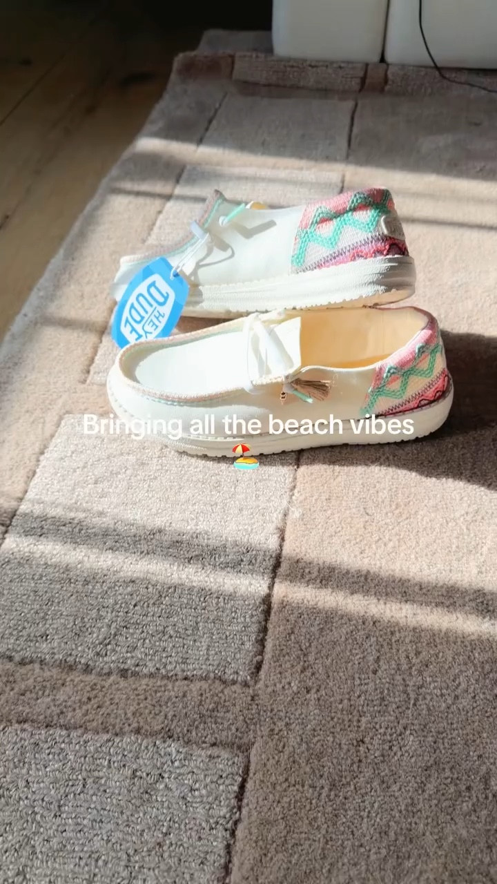 HeyDude Wendy beach slip on. These give such a beach vacation vibe. The colors are so cute for summer and they even have a gold seashell charm. So cute!
#ad

#LTKootd #LTKFestival #LTKSaleAlert