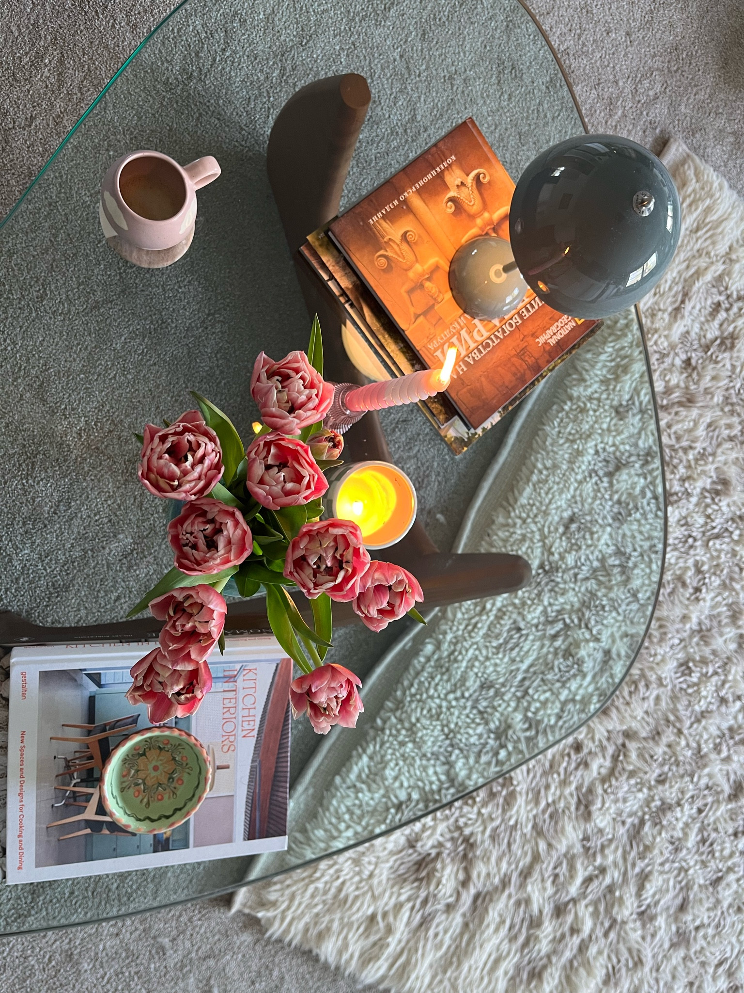 Spring coffee table views! Love this Noguchi style table—such a great Wayfair find. It is very well made—real wood and very thick and heavy glass. The checkered rug is West Elm. And of course, the Panton Flowerpot lamp! 💙