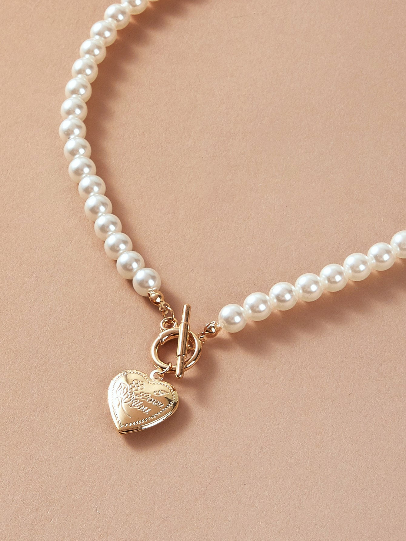 Heart Charm Faux Pearl Decor Necklace
   SKU: swneck03200226989      
          (9774 Reviews)
  ... | SHEIN