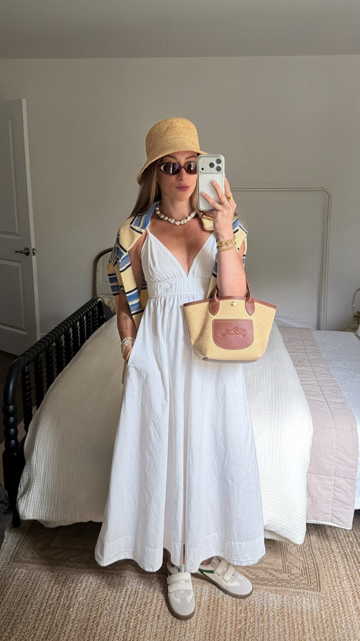 5/14/26 PGA Championship Spectator Outfit

What I wore for a day at the PGA Championship 🤍 my Aritzia white dress layered with a striped Reformation sweater, plus a bucket hat, Longchamp bag, and easy sneakers for walking around all day. Comfortable but still put together—everything is linked here ✨

#LTKootd #LTKSeasonal