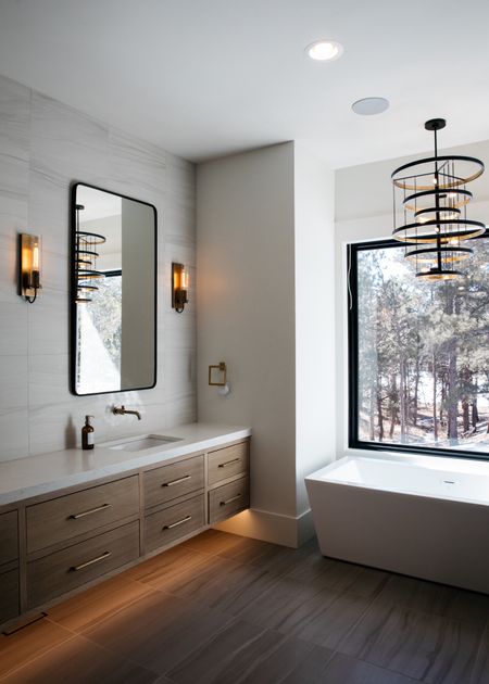 The chandelier in our primary bathroom was definitely worth the splurge. It gives off a gorgeous glow and looks perfect over the tub.

#LTKHome #LTKStyleTip