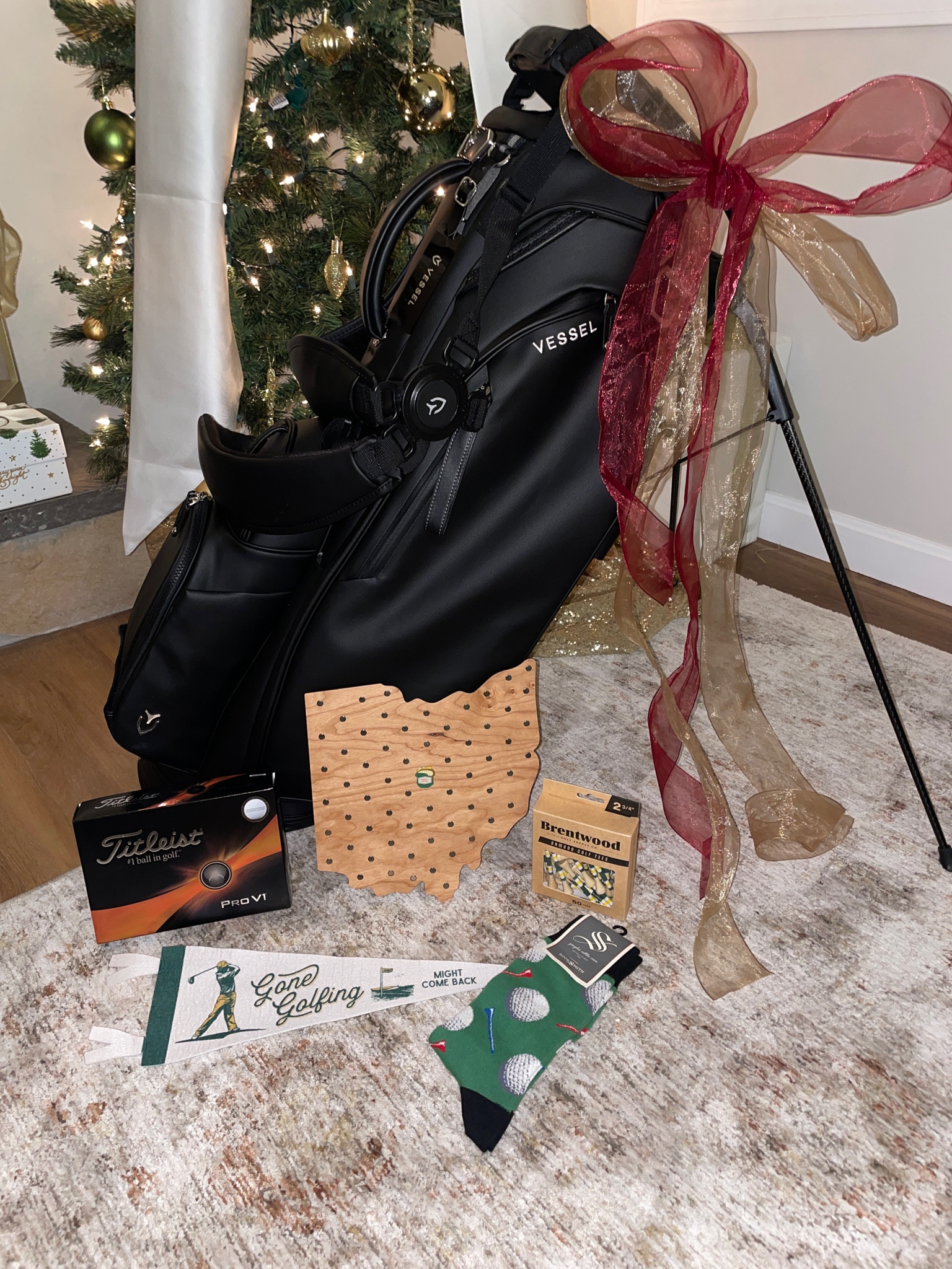 The best Christmas gifts for the golfer in your life! My boyfriend absolutely loved this stunning leather golf bag. I got his favorite bamboo golf tees and ProV 1 tees, along with a custom golf ball marker holder for his wall, a golf flag and dress socks! 

#LTKMens #LTKHoliday #LTKGiftGuide