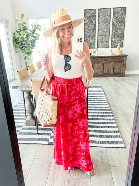 Love these tropical wide leg pants with a white tank top, white sandals, straw hat and bag. Small pants and medium tank. Sandals tts. Beach vacation travel outfit amazon fashio  

#LTKFindsUnder50 #LTKTravel #LTKSeasonal