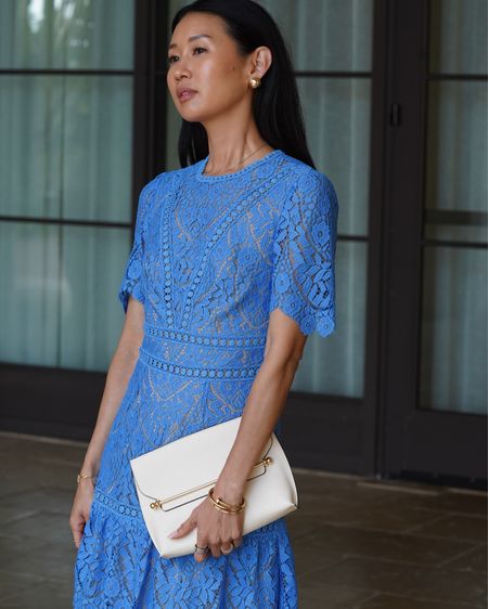 Wedding dress season is here and loving this blue, lace mini dress! This color is stunning and the lace details are beautiful with the open back! Pair it with simple gold earrings. 

#LTKWedding #LTKOver40 #LTKStyleTip