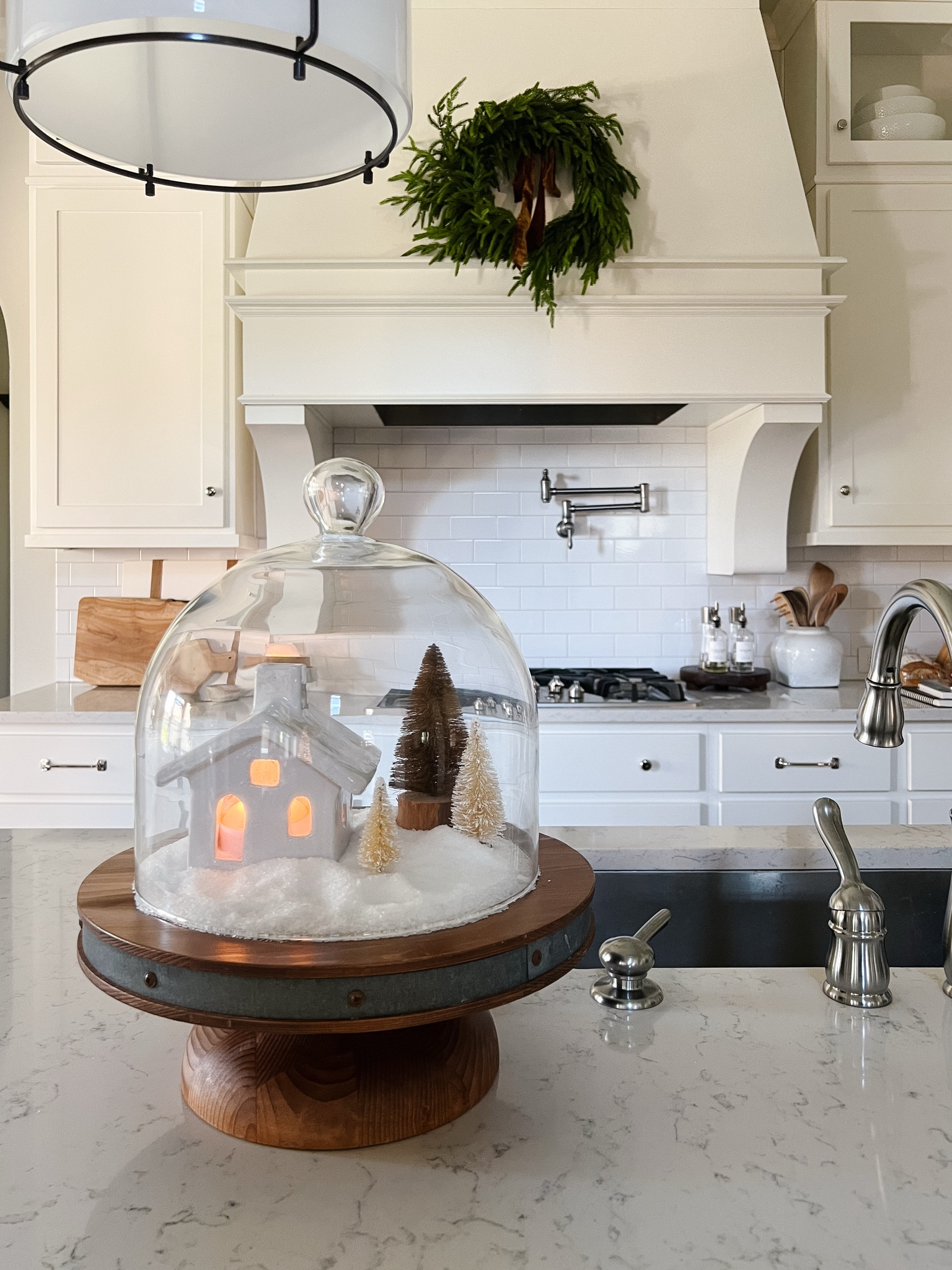 Make a cute snow globe for your kitchen with epsom salt, your cake stand, and a glass dome.

My cake stand and dome are no longer available, but linking to some great options below.

#LTKHome #LTKHoliday