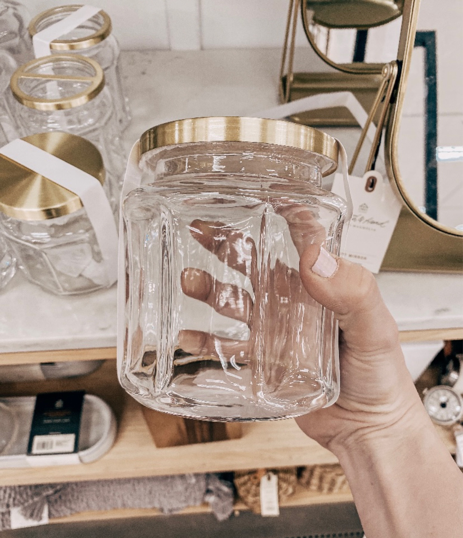 Sculpted Glass Canister Clear/Brass @ Target with Hearth & Hand with Magnolia. 
These glass canisters with brass lids are gorgeous! They are a really great quality! I love the glass detail on them! This one was size small, but there is a larger size available also.