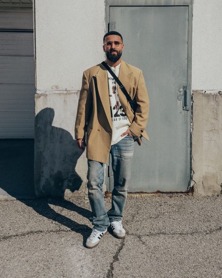 FEAR OF GOD 7th Collection California Blazer in ‘Camel’ (size 48) and 3-Year Vintage Wash Jeans (size 33). FEAR OF GOD x RRR123 The Witness Longsleeve Shirt in ‘White’ (size 2). THE ROW Slouchy Banana Bag in ‘Black’. FEAR OF GOD x BARTON PERREIRA glasses in ‘Matte Linen’. ADIDAS Samba OG sneakers in ‘White/Grey/Brown/Black’ (size 9.5US). A relaxed and elevated men’s date night look that provides comfortable proportions and ease of layering. 

#LTKmens #LTKstyletip