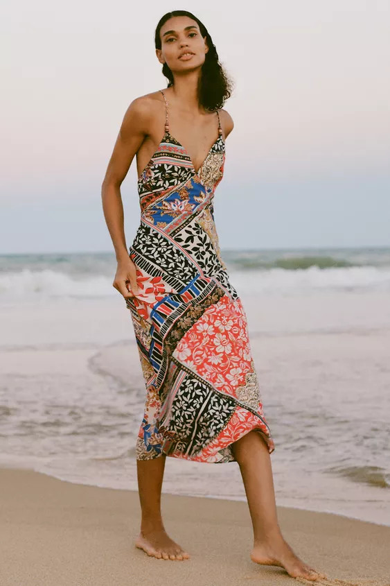 Slip dress with a V-neck, thin beaded straps and a concealed side zip fastening. | Zara UK